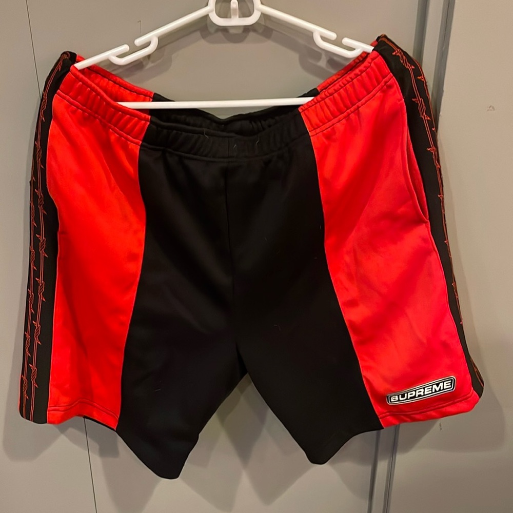 Supreme men’s large, red and black, athletic shorts with drawstring